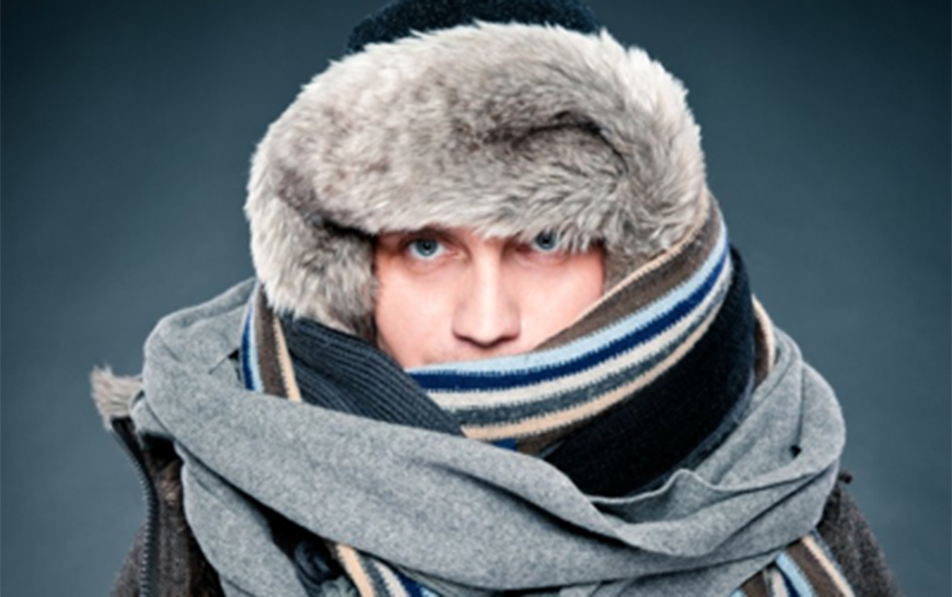 A man wrapped up against the cold in scarves